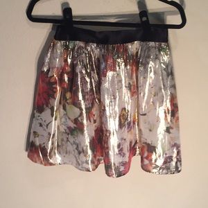 Shiny skirt by Bebe is size Small